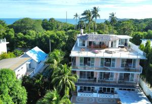 an aerial view of a house with palm trees at Phuket Arkadia Home in Nai Harn Beach