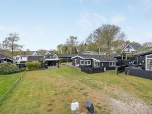 an aerial view of a yard with houses at Holiday Home Aarto - 250m from the sea by Interhome in Sæby