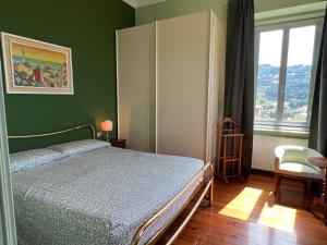 Ένα ή περισσότερα κρεβάτια σε δωμάτιο στο Garden Seaview Camogli +66 φωτογραφίες