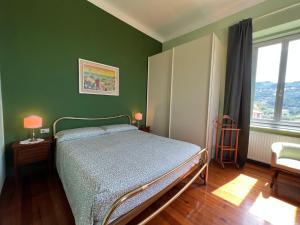 Ένα ή περισσότερα κρεβάτια σε δωμάτιο στο Garden Seaview Camogli