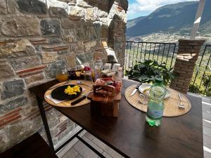 a table with two plates of food on a balcony at Antica Dimora in Trentinara