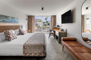 a hotel room with a bed and a couch at TUI BLUE Atlantic Hills in Puerto de la Cruz