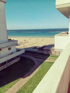 a view of the beach from the balcony of a beach house at Casa Vacanze in Lido Adriano