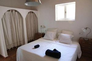Ένα ή περισσότερα κρεβάτια σε δωμάτιο στο Agroturismo Casa Morna Ibiza