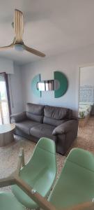 a living room with a couch and a table at Horizonte al Mar in Miramar
