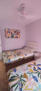 two beds sitting next to each other in a room at Horizonte al Mar in Miramar