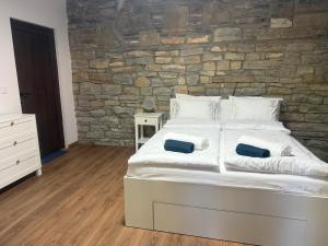 Postel nebo postele na pokoji v ubytování Синята къща La casa Blu