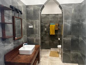a bathroom with a sink and a shower at Garden Beach Villa Zanzibar in Kilima Juu Pwani +74 photos