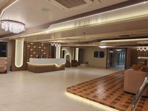 a lobby with a waiting room with chairs and a table at JEEVAN SANDHYA in Puri