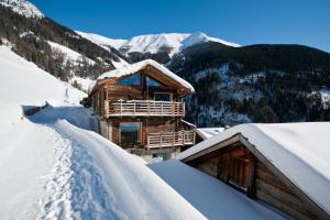 a log cabin in a snow covered mountain at Montagne Alternative in Orsières