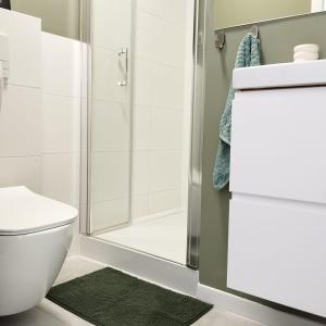 a bathroom with a shower and a toilet at Apartment Rozbrat 5 in Wrocław +12 photos