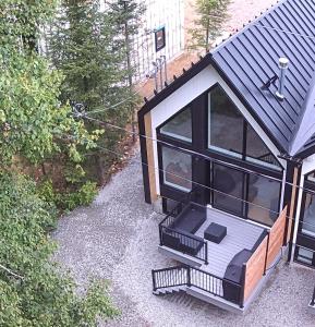 an overhead view of a house with a balcony at Chalet Les 3 Versants Mont-Edouard 38A in LʼAnse-Saint-Jean
