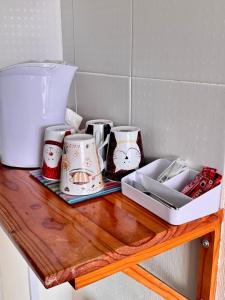 a table with cups and containers on top of it at Kendal Hotel in Blackpool +39 photos
