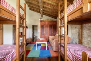 Giường trong phòng chung tại La Casa vacacional del Güelu