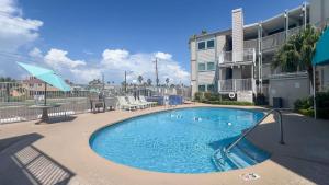 a swimming pool in front of a apartment building at La Internacional 313 home in South Padre Island