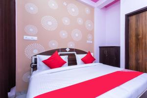 Postel nebo postele na pokoji v ubytování Hotel O Home Stay