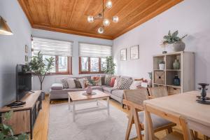 a living room with a couch and a table at Detached Triplex with Garden Terrace in Istanbul