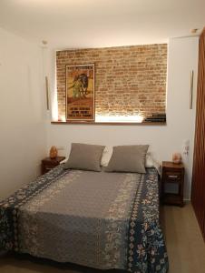 En eller flere senge i et værelse på WOWHOLIDAYS Superloft Ronda