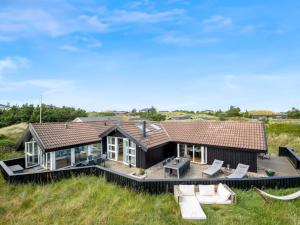 an aerial view of a house with a deck at Holiday Home Emin - 700m from the sea by Interhome in Vejers Strand