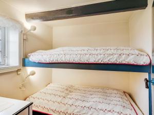 Ένα ή περισσότερα κρεβάτια σε δωμάτιο στο Holiday Home Vili - 100m from the sea by Interhome