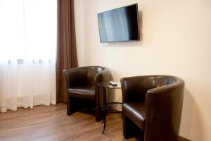 Telewizja i/lub zestaw kina domowego w obiekcie Apartamenty Hotelu Pod Orłem