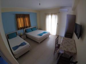 Postel nebo postele na pokoji v ubytování Riviera Rooms