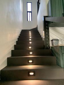 a staircase in a building with lights on it at Ocean view 1 bedroom, 1 bathroom in Port Antonio +1 photo