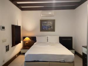 a bedroom with a large white bed in a room at Private Pool Getaway in a Luxury Stone Villa in Bodrum City