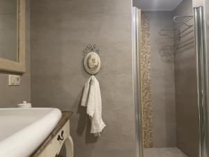 a bathroom with a shower and a towel on the wall at Private Pool Getaway in a Luxury Stone Villa in Bodrum City +51 photos
