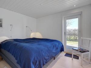 Postel nebo postele na pokoji v ubytování Holiday Home Fredrikke - 50m from the sea by Interhome