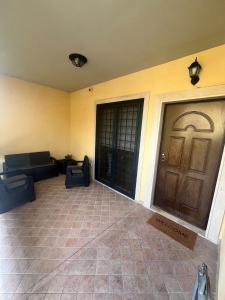 a living room with a couch and a door at La Casa Di Giulia in Rome
