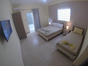 Postel nebo postele na pokoji v ubytování Riviera Rooms