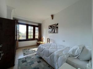 Postel nebo postele na pokoji v ubytování Villa Maadi 35 - R 202 - Street View Room + 26 fotografií