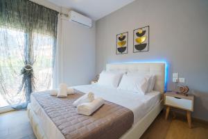 Ένα ή περισσότερα κρεβάτια σε δωμάτιο στο Relax Home Meteora