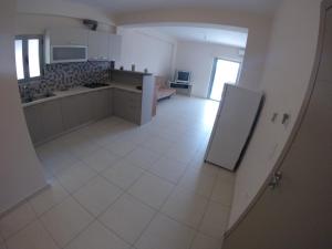Kuchyň nebo kuchyňský kout v ubytování Riviera Rooms