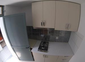 Kuchyň nebo kuchyňský kout v ubytování Riviera Rooms