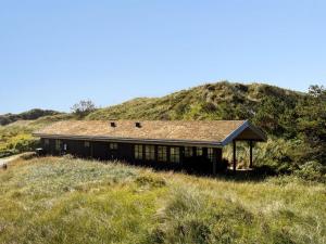 a house sitting on top of a hill at Holiday Home Marite - 200m from the sea by Interhome in Pandrup