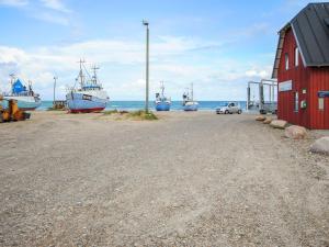 a group of boats are docked on a beach at Holiday Home Wilja - 400m from the sea by Interhome in Fjerritslev