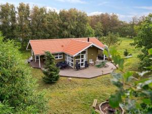 an aerial view of a house with a deck at Holiday Home Karitte - 5km from the sea by Interhome in Fjerritslev +15 photos