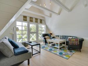 a living room with a couch and a table at Holiday Home Tamer - 500m to the fjord by Interhome in Farsø