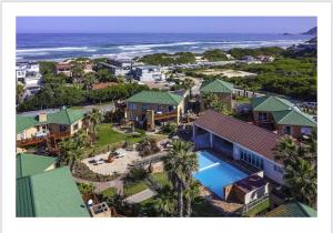 an aerial view of a house and the ocean at 122 Shearwater - Nora's Place in Sedgefield