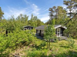 a small house in the middle of a field at Holiday Home Ascen - 300m from the sea by Interhome in Læsø