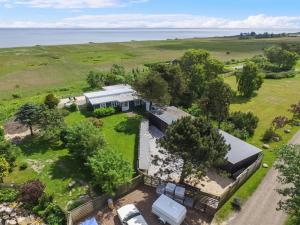 an aerial view of a house with a lot of trees at Holiday Home Marlena - 150m from the sea by Interhome in Frederikshavn