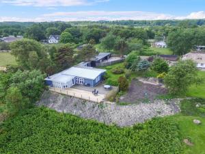 an aerial view of a house with a large yard at Holiday Home Marlena - 150m from the sea by Interhome in Frederikshavn
