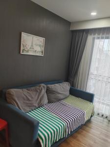 a bed in a room with a window at Quiet 2 bedroom apartment in Ban Nong Chaeng +10 photos