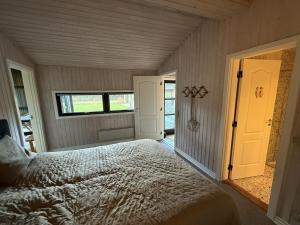 Ένα ή περισσότερα κρεβάτια σε δωμάτιο στο Holiday Home Glenda - 3km from the sea by Interhome