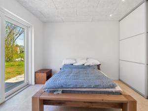 Postel nebo postele na pokoji v ubytování Holiday Home Hidde - 200m from the sea by Interhome + 10 fotografií