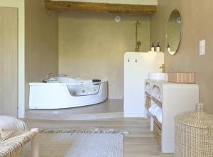 a living room with a sink and a refrigerator at Cocooning and spa in Varages +9 photos
