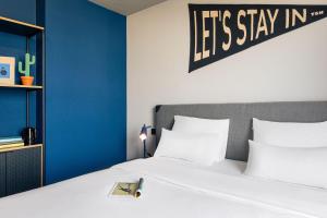 Ένα ή περισσότερα κρεβάτια σε δωμάτιο στο The Social Hub Vienna