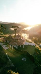 an aerial view of a house on a hill at Atiaia Jungle River Retreat in Visconde De Maua